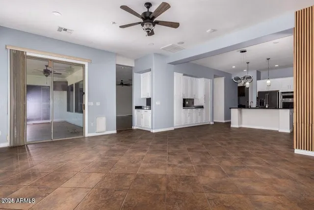 a view of a livingroom with a kitchen
