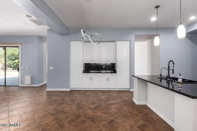a view of a kitchen with a sink and a window