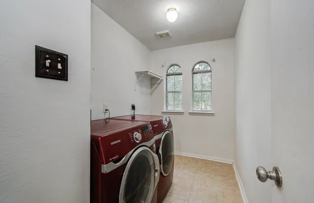 a utility room with dryer and washer