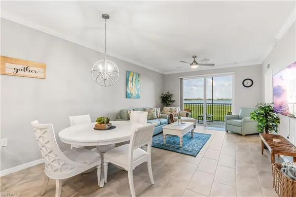 a living room with furniture a window and a table