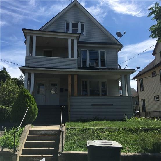 278 Wayne Street Bridgeport, CT 06606 - Photo 1 of 1 a front view of a house with a yard