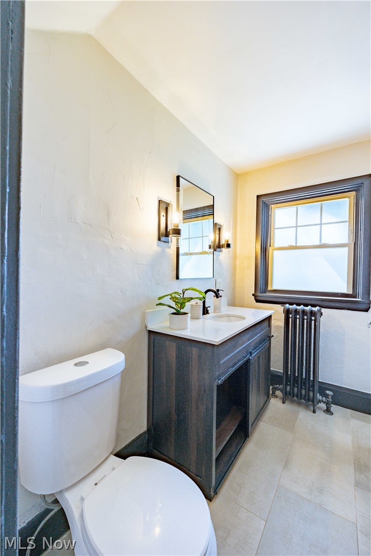 3254 Redwood Road Cleveland Heights, OH 44118 - Photo 29 of 49 Bathroom featuring radiator, toilet, a wealth of natural light, and vanity