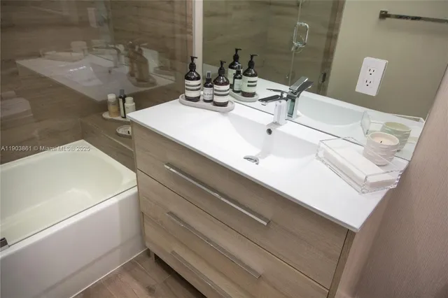 a bathroom with a sink and a mirror