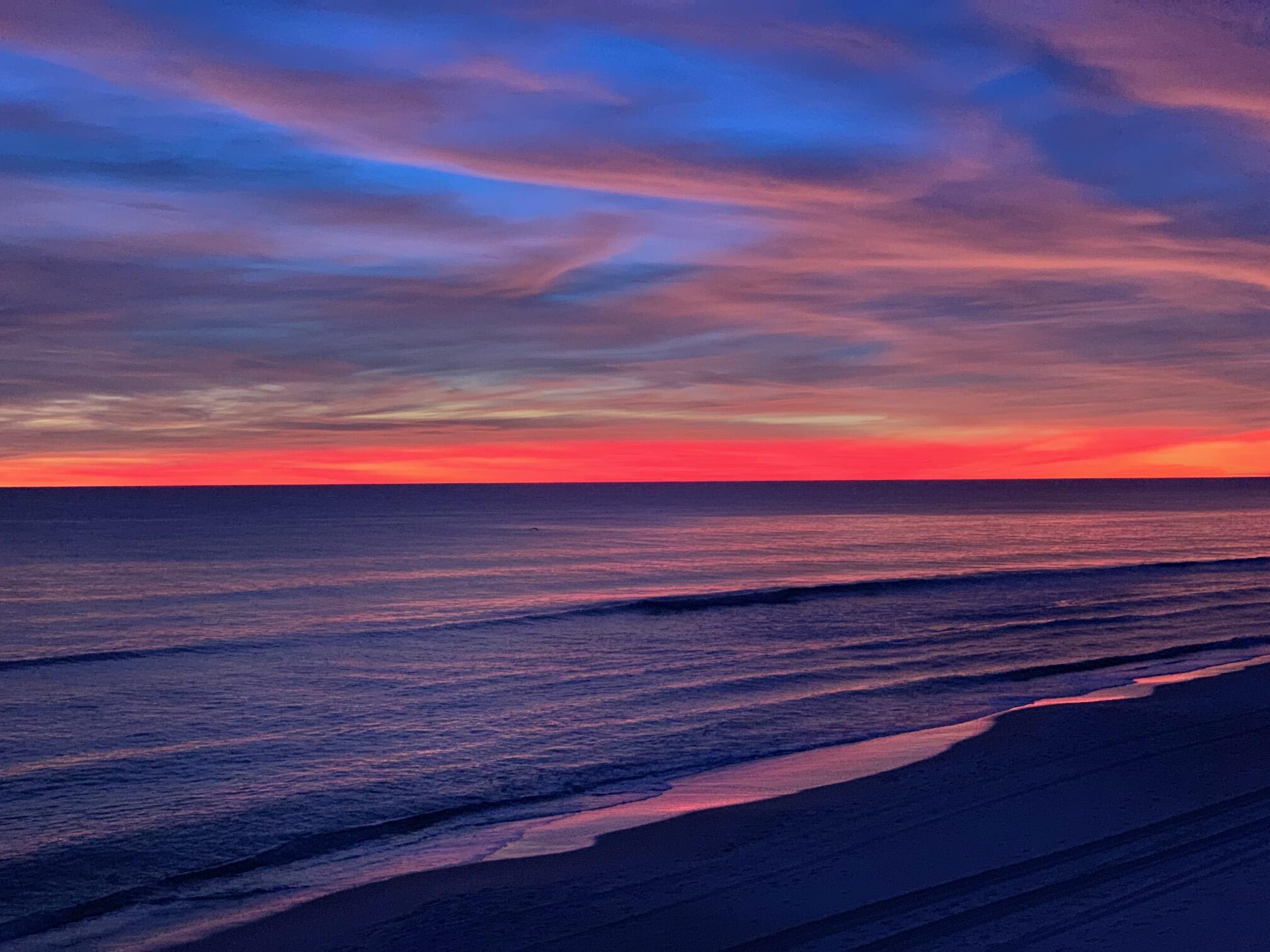 Undisclosed Address Panama City Beach, FL 32413 - Photo 17 of 20 a backyard of a house with wooden seating