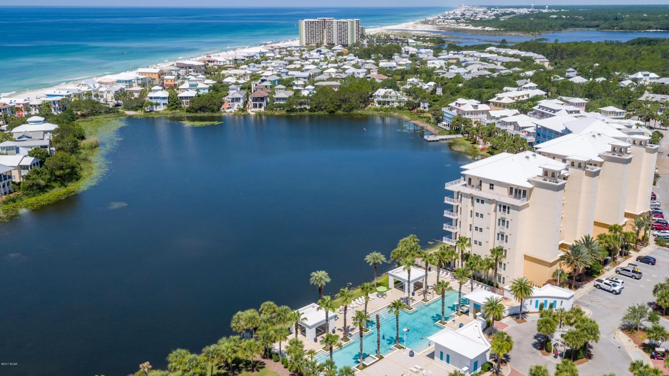 Undisclosed Address Panama City Beach, FL 32413 - Photo 18 of 20 a view of a lake with a building in the background