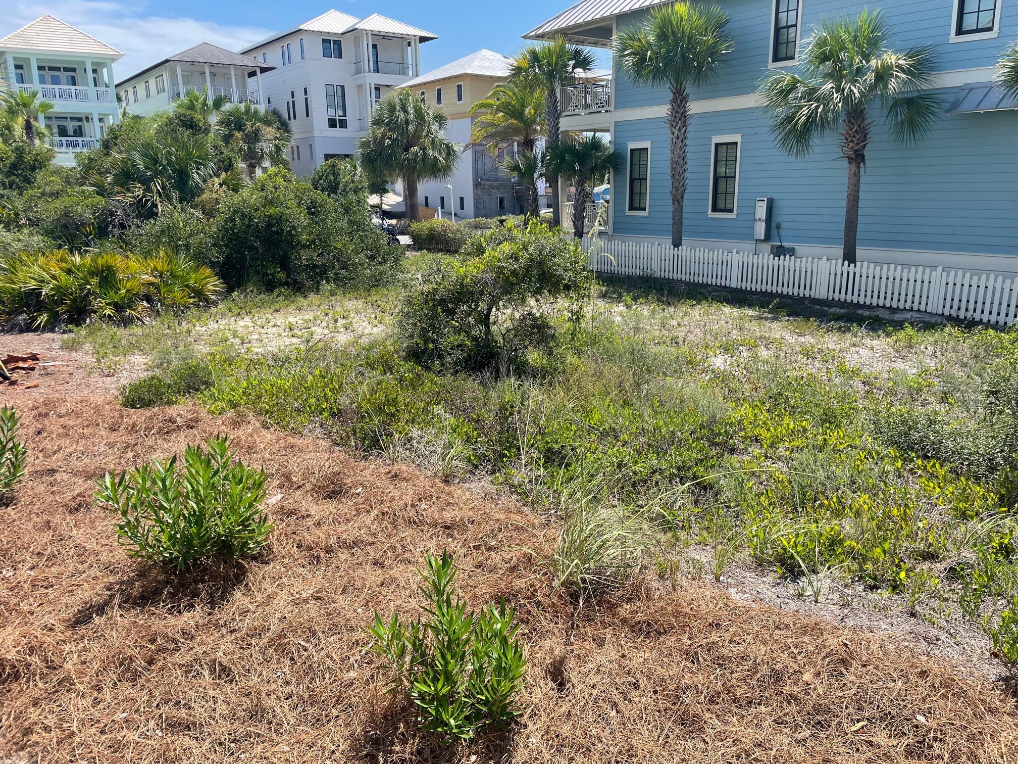 Undisclosed Address Panama City Beach, FL 32413 - Photo 3 of 20 a view of a garden with a house