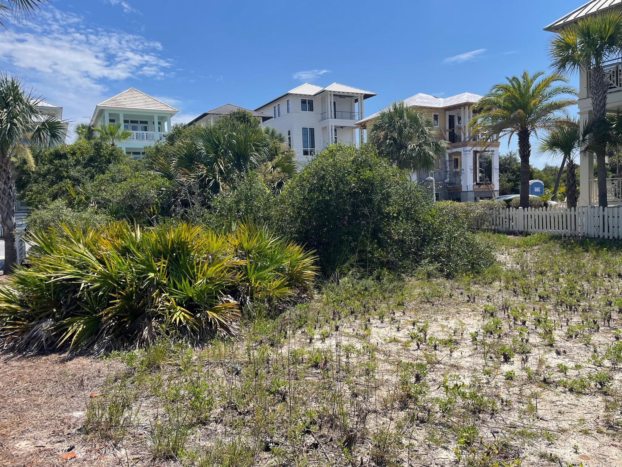 Undisclosed Address Panama City Beach, FL 32413 - Photo 5 of 20 a view of a houses with a yard and plants