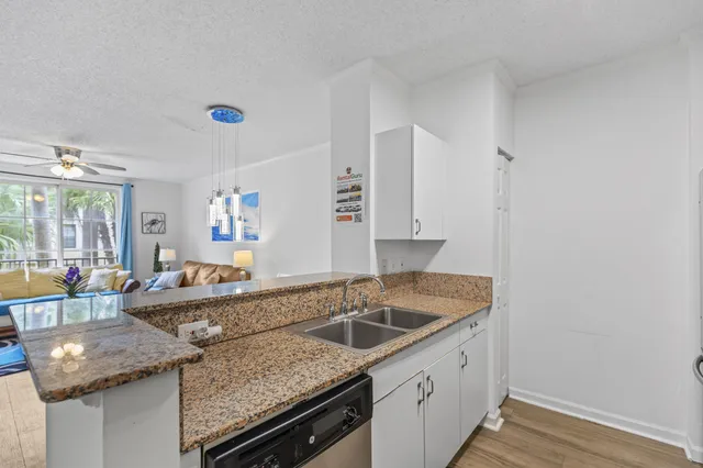 a kitchen that has a sink and a stove