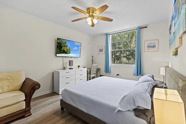 a bedroom with a bed and a chair