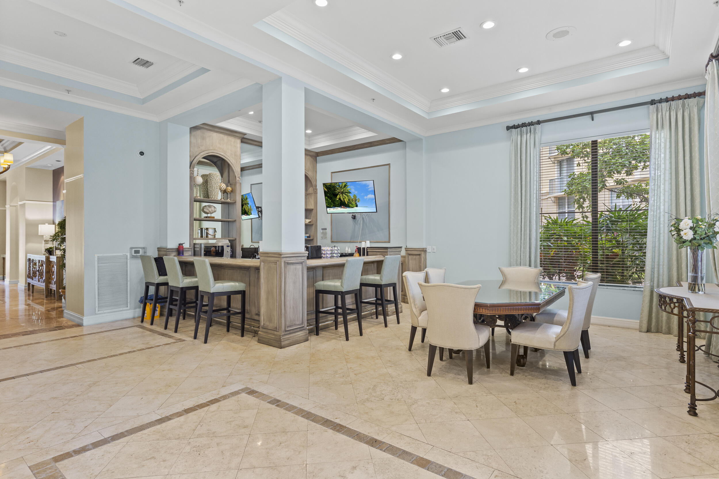 630 South Sapodilla Avenue, Unit 202 West Palm Beach, FL 33401 - Photo 20 of 31 a view of a dining room with furniture and a potted plant