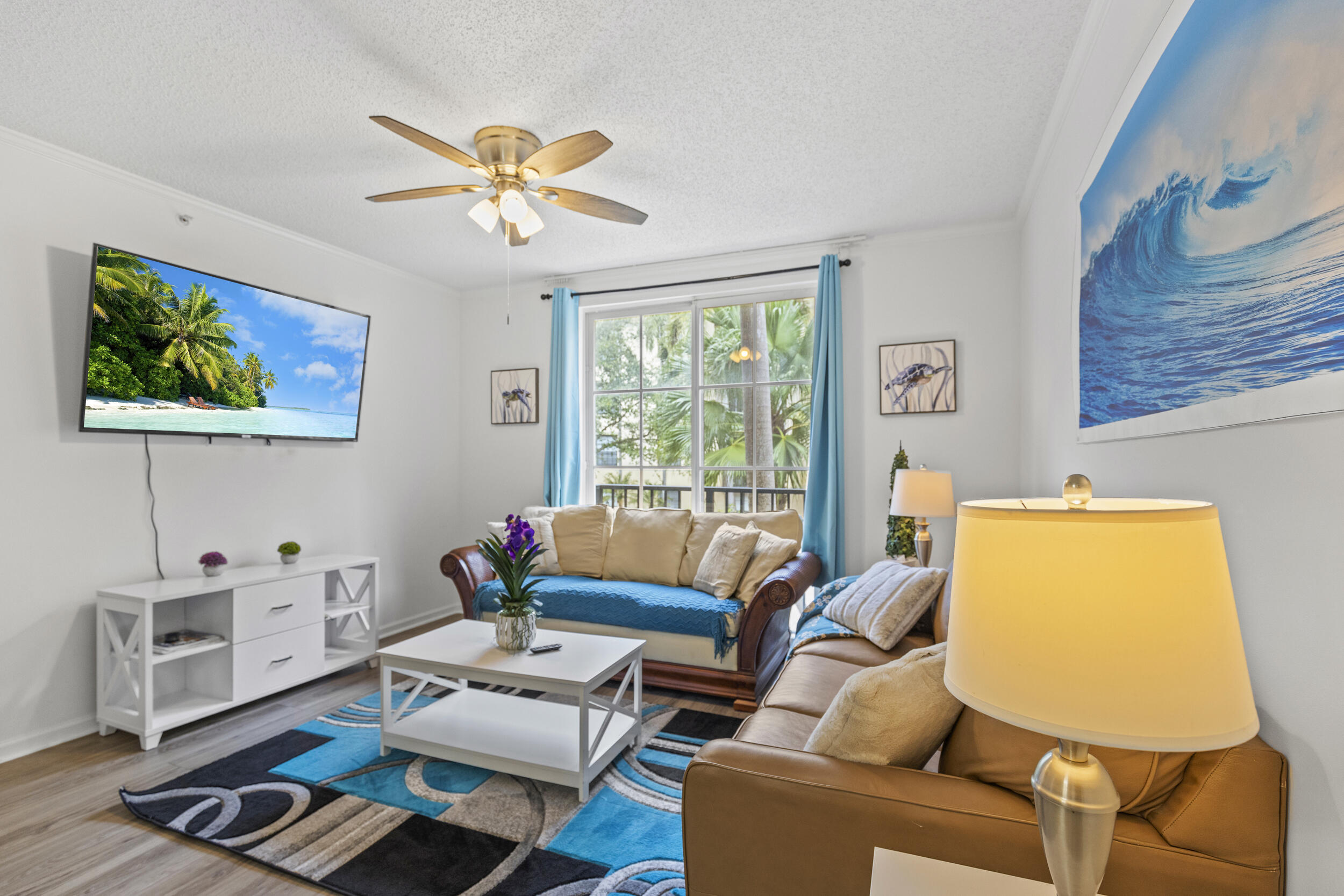 630 South Sapodilla Avenue, Unit 202 West Palm Beach, FL 33401 - Photo 2 of 31 a living room with furniture and a window