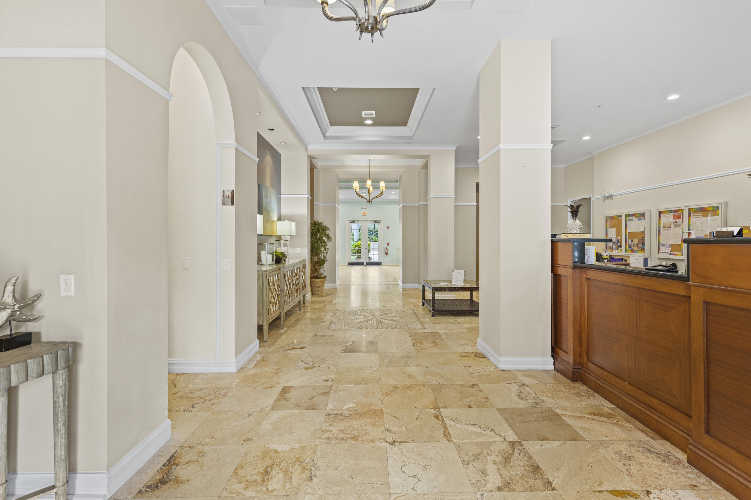 630 South Sapodilla Avenue, Unit 202 West Palm Beach, FL 33401 - Photo 27 of 31 a view of a hallway with wooden floor and a living room