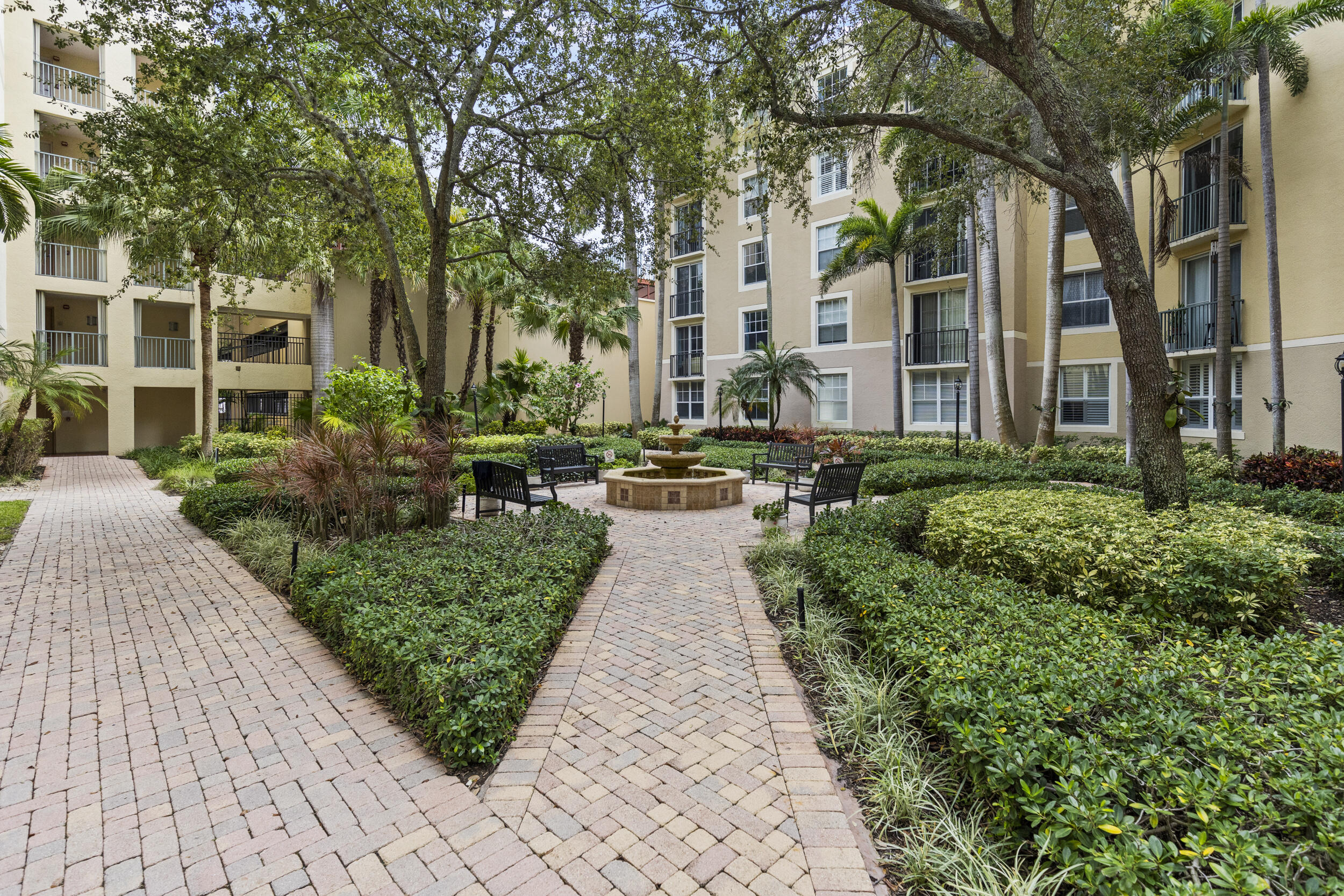 630 South Sapodilla Avenue, Unit 202 West Palm Beach, FL 33401 - Photo 30 of 31 a view of a pathway with a garden