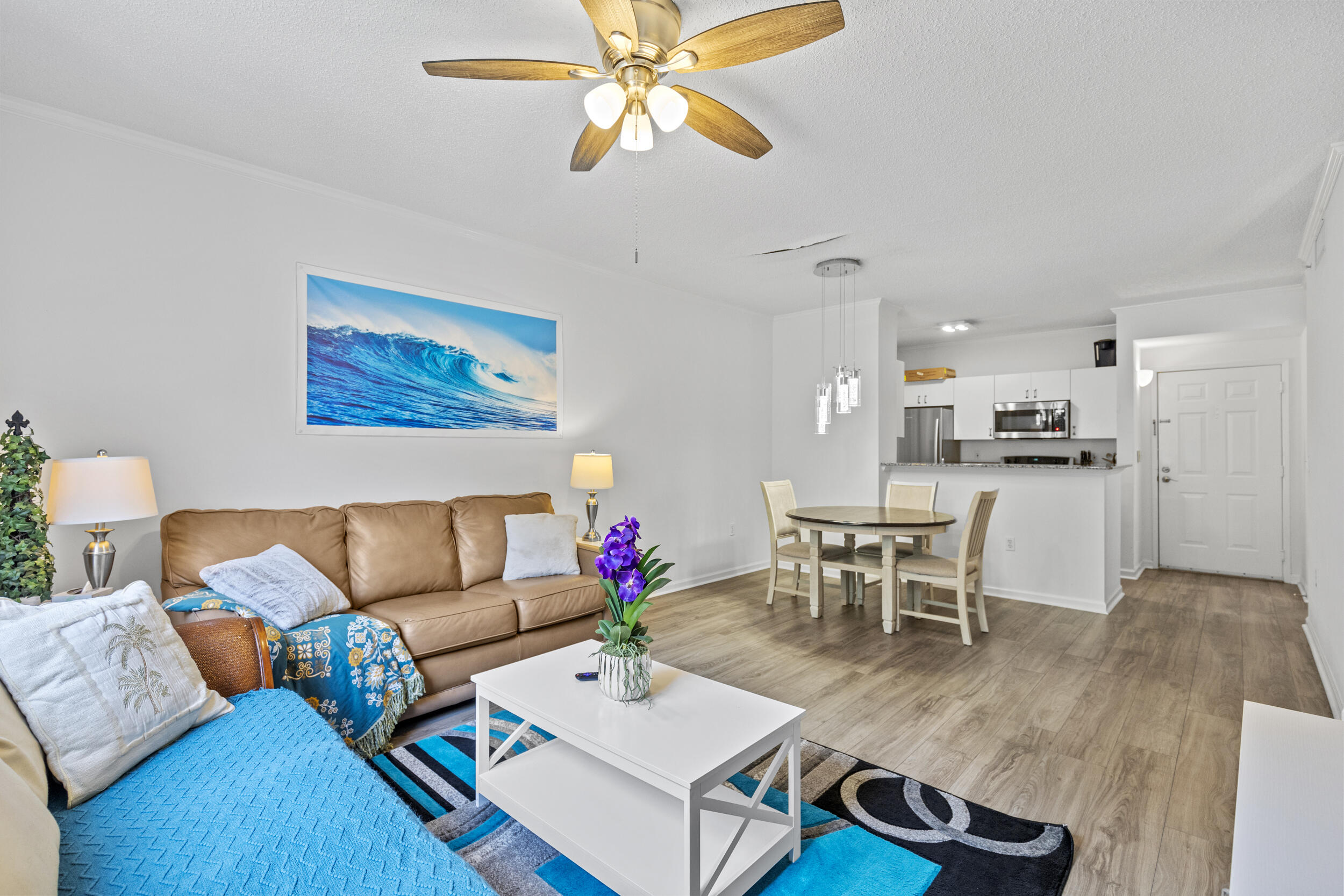 630 South Sapodilla Avenue, Unit 202 West Palm Beach, FL 33401 - Photo 5 of 31 a living room with furniture and kitchen view