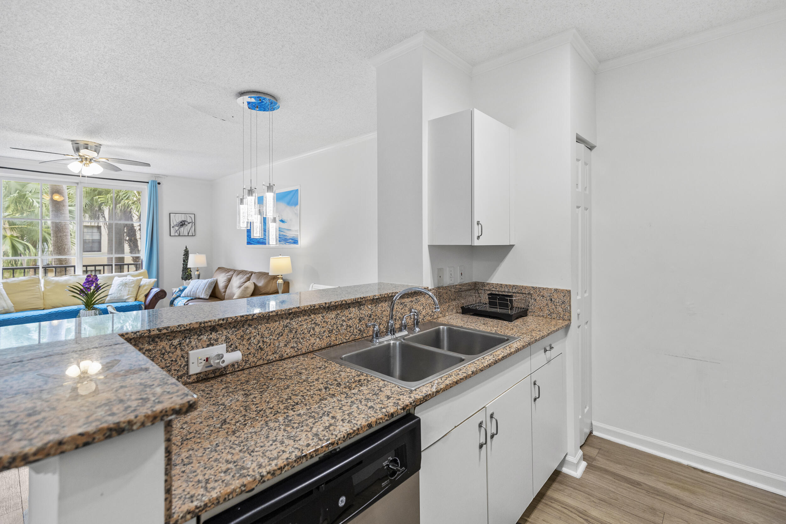 630 South Sapodilla Avenue, Unit 202 West Palm Beach, FL 33401 - Photo 9 of 31 a kitchen with granite countertop a sink and a stove