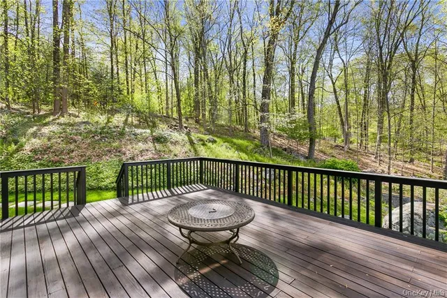 a view of a two chairs with wooden floor in front of house