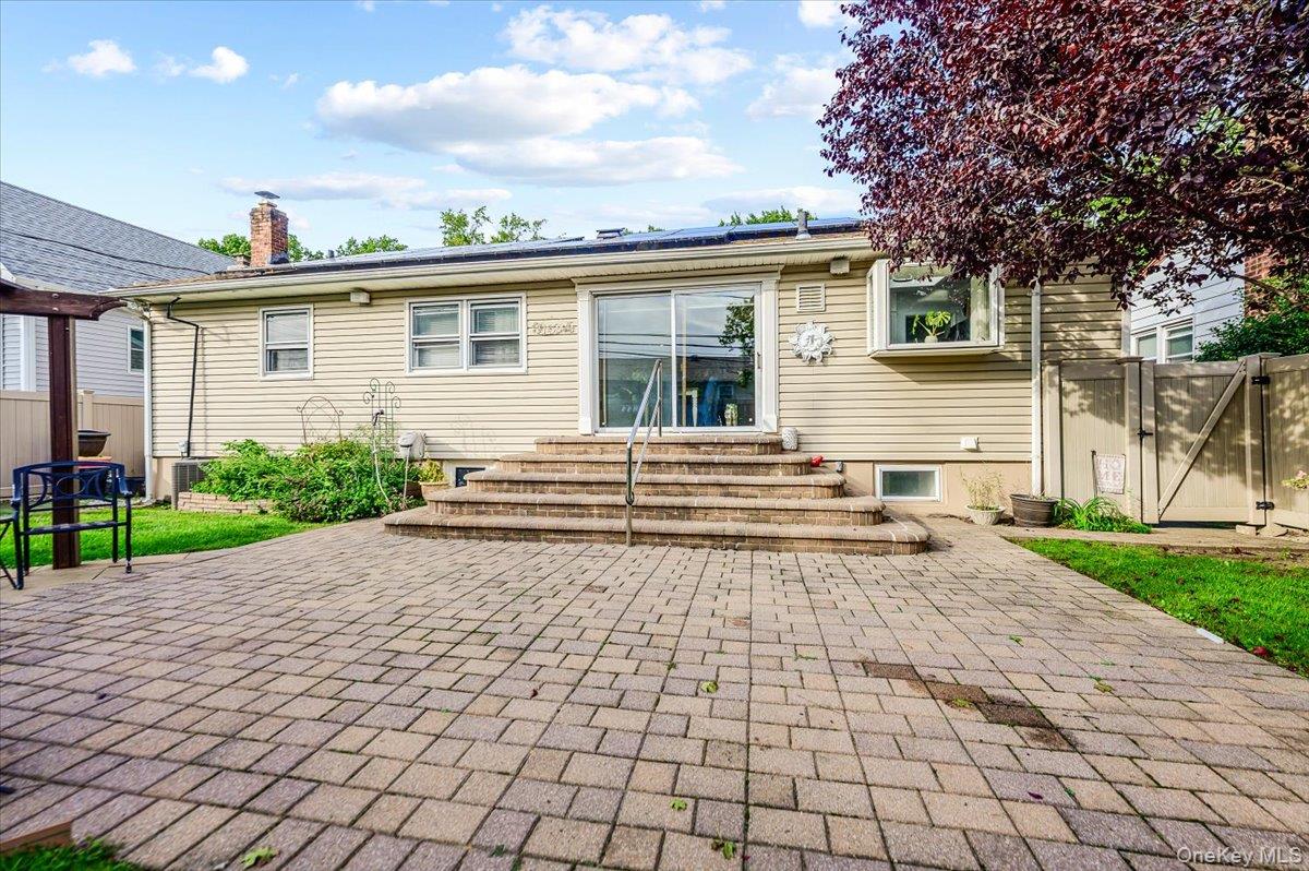 91 Flower Road Valley Stream, NY 11581 - Photo 26 of 28 Backyard with paved patio