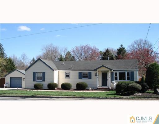 337 Manalapan Road Spotswood, NJ 08884 - Photo 1 of 10 a front view of a house with a yard