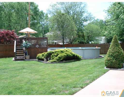 337 Manalapan Road Spotswood, NJ 08884 - Photo 9 of 10 a view of a garden with a bench in patio