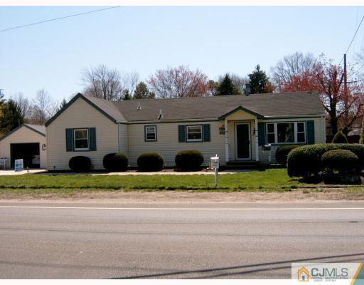337 Manalapan Road Spotswood, NJ 08884 - Photo 10 of 10 a front view of a house with a yard and garage