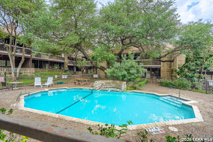 8655 Datapoint, Unit 403 San Antonio, TX 78229 - Photo 22 of 22 a view of a swimming pool with chairs