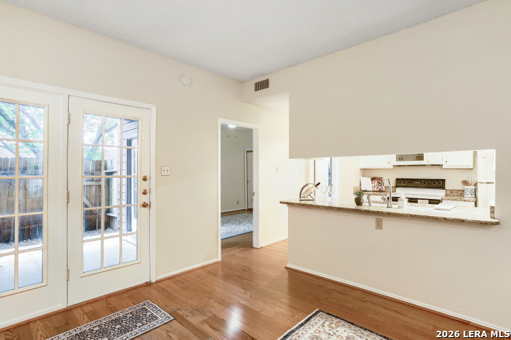 8655 Datapoint, Unit 403 San Antonio, TX 78229 - Photo 4 of 22 a living room with stainless steel appliances kitchen island granite countertop a refrigerator and a stove top oven