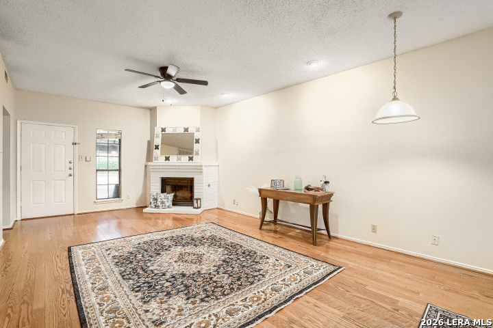 8655 Datapoint, Unit 403 San Antonio, TX 78229 - Photo 5 of 22 a view of a livingroom with furniture and a fireplace