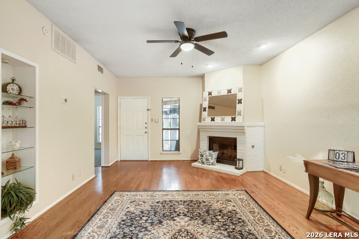 8655 Datapoint, Unit 403 San Antonio, TX 78229 - Photo 10 of 22 a living room with furniture and a fireplace