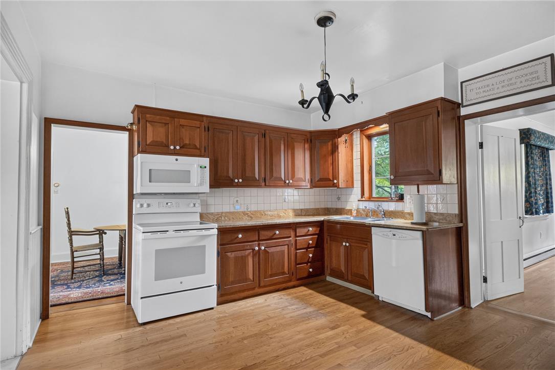 765 East Macada Road Bethlehem, PA 18017 - Photo 17 of 46 A classic kitchen with abundant wood cabinetry and a functional layout offers ample storage and workspace.
