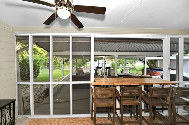 a dining room with furniture window and outside view