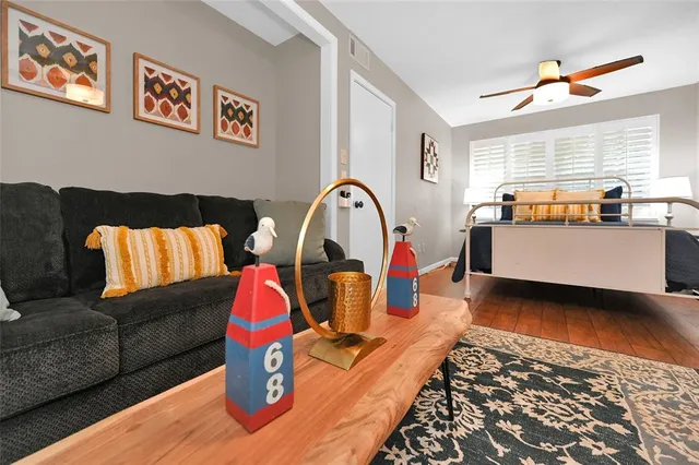 a living room with furniture and window