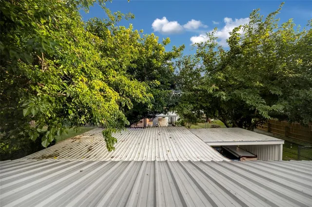 a view of balcony with wooden floor