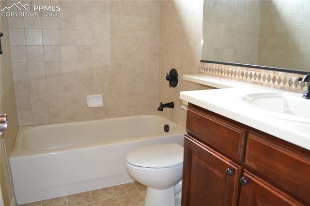 2353 Cinnabar Road Colorado Springs, CO 80921 - Photo 36 of 48 Main level bathroom adjacent to bedroom #2