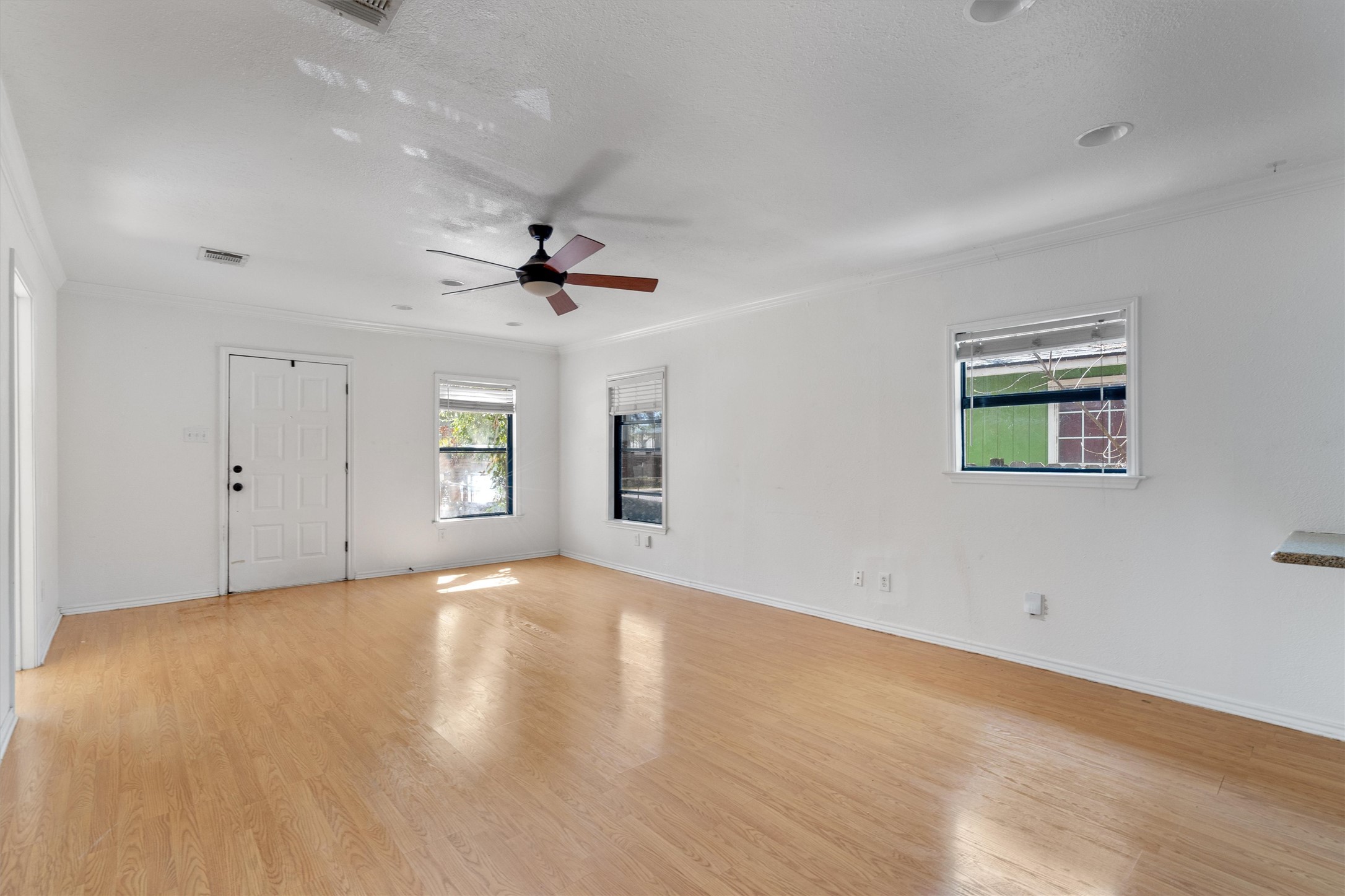 2710 East 3rd Street Austin, TX 78702 - Photo 11 of 28 a view of an empty room with a window