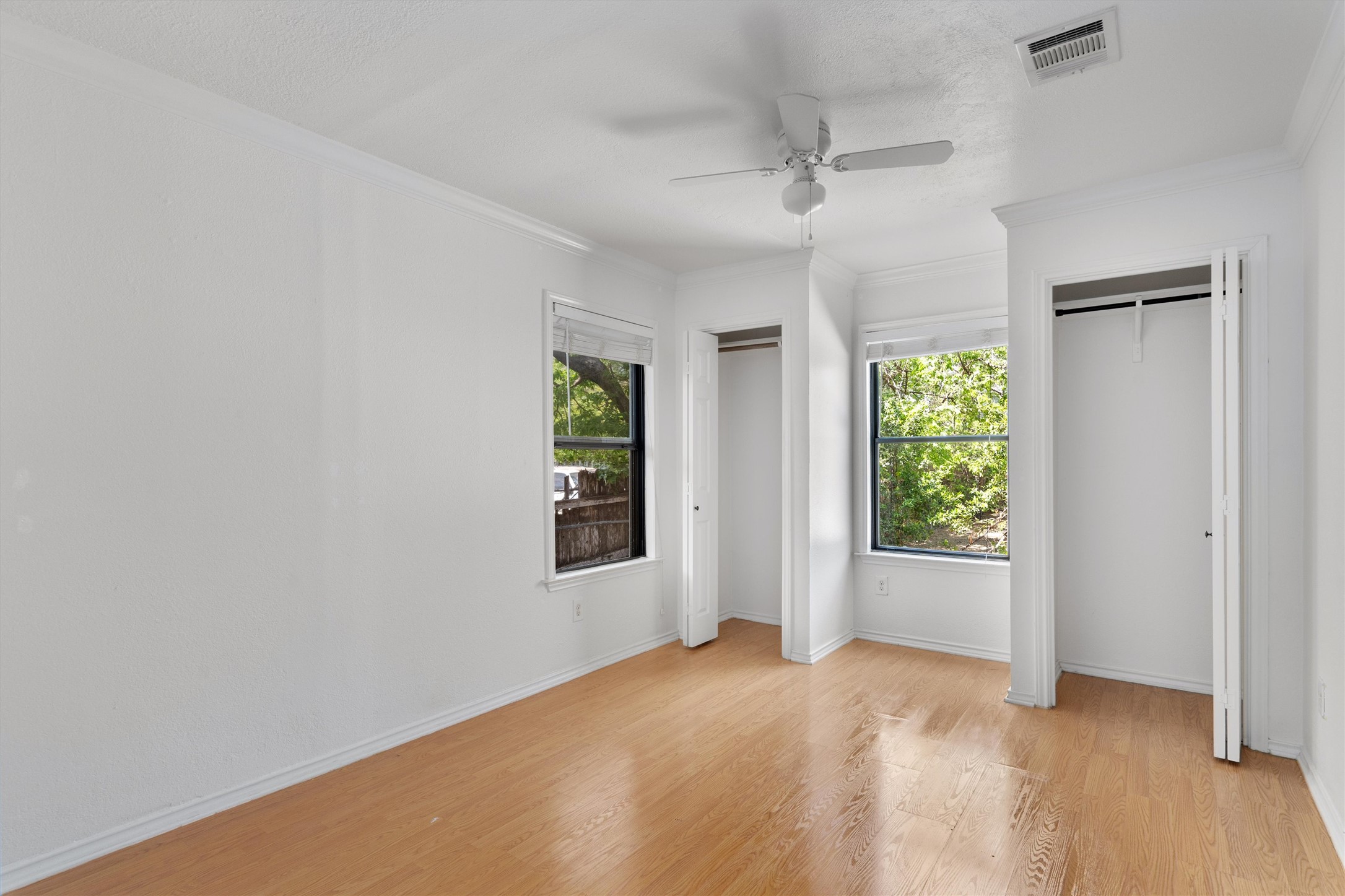 2710 East 3rd Street Austin, TX 78702 - Photo 12 of 28 an empty room with windows and closet