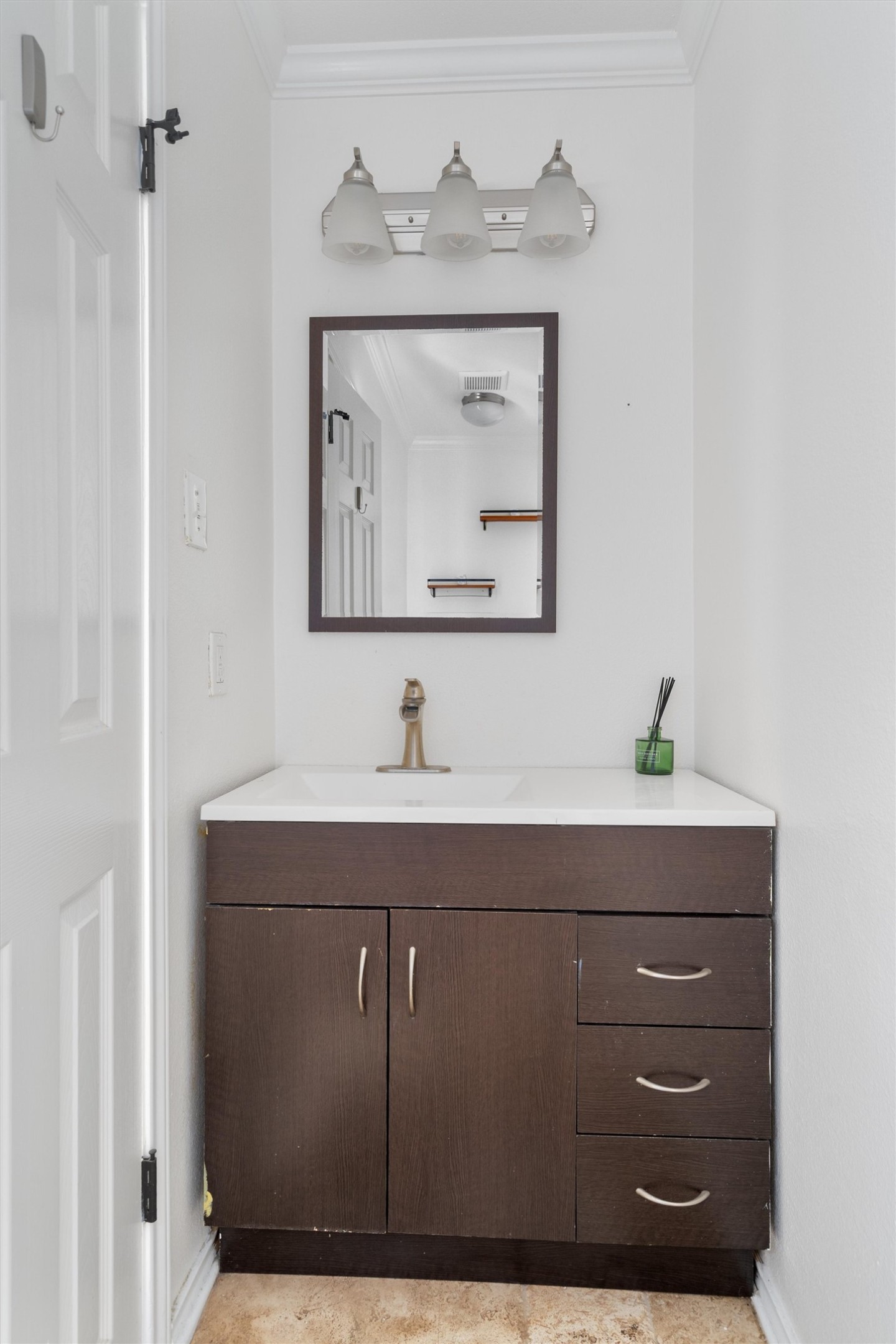 2710 East 3rd Street Austin, TX 78702 - Photo 15 of 28 a bathroom with a sink a vanity and mirror