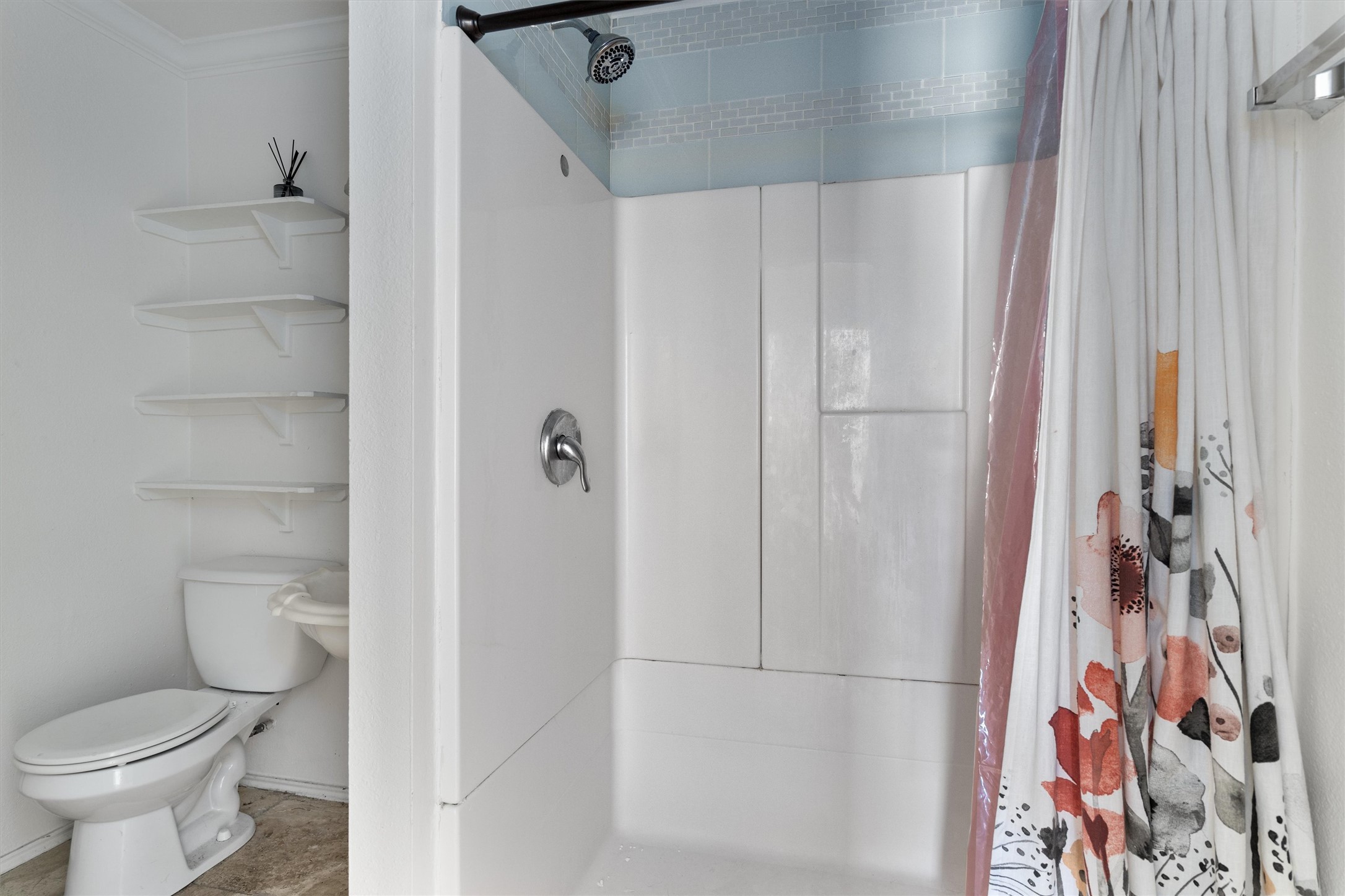 2710 East 3rd Street Austin, TX 78702 - Photo 18 of 28 a bathroom with a toilet and a shower