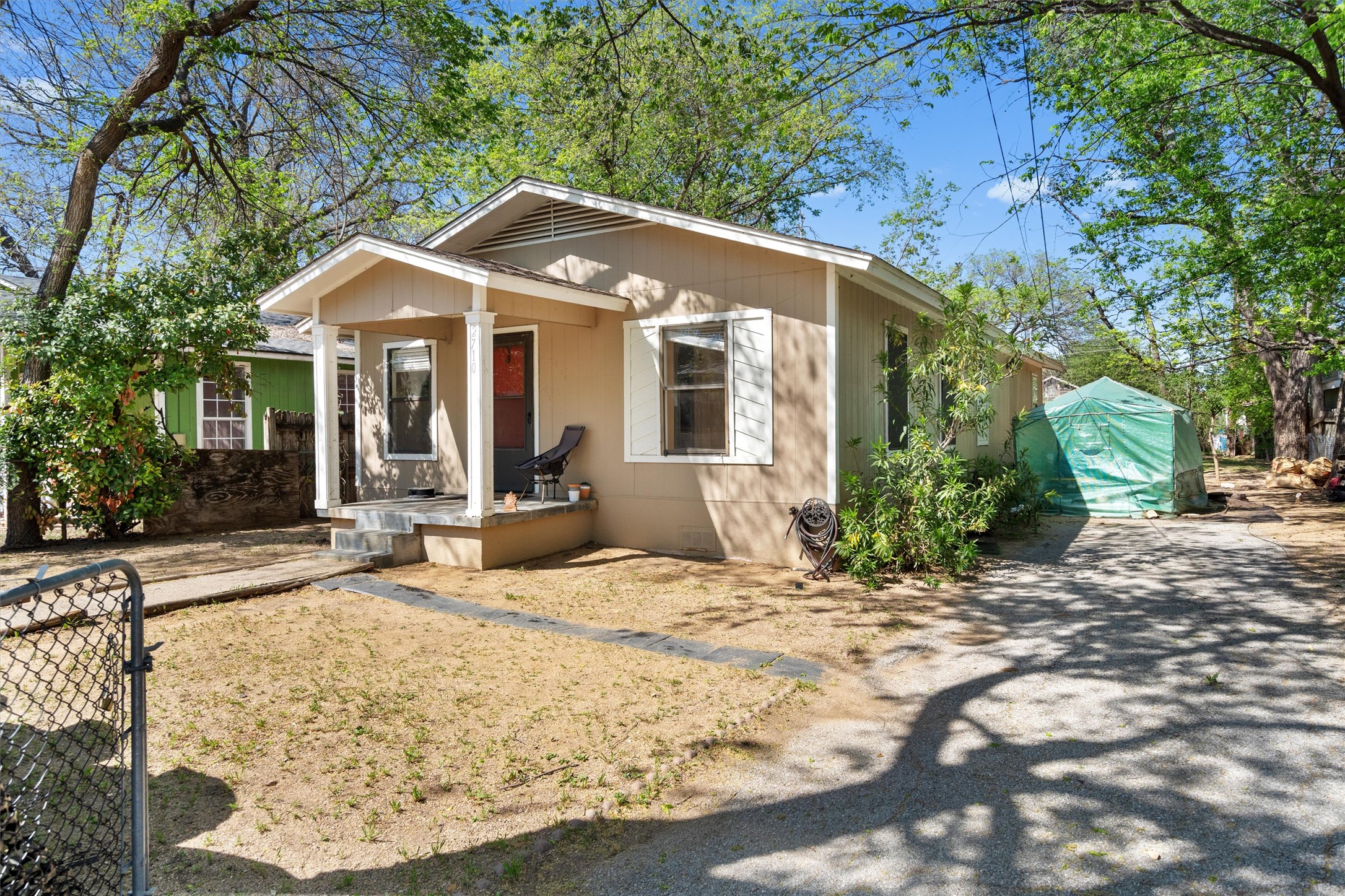2710 East 3rd Street Austin, TX 78702 - Photo 2 of 28 a front view of a house with garden