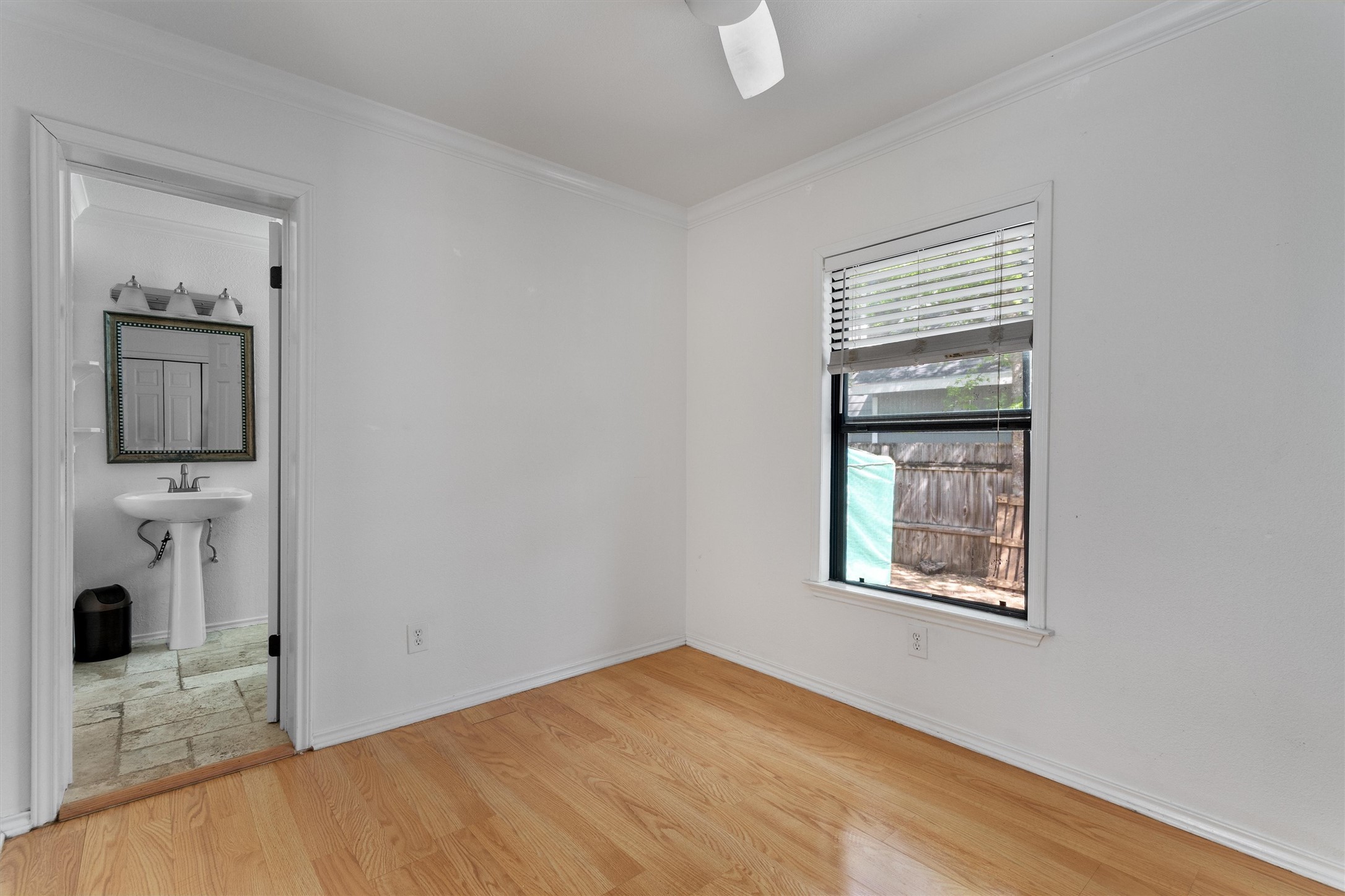 2710 East 3rd Street Austin, TX 78702 - Photo 21 of 28 a view of a livingroom with wooden floor and a bathroom