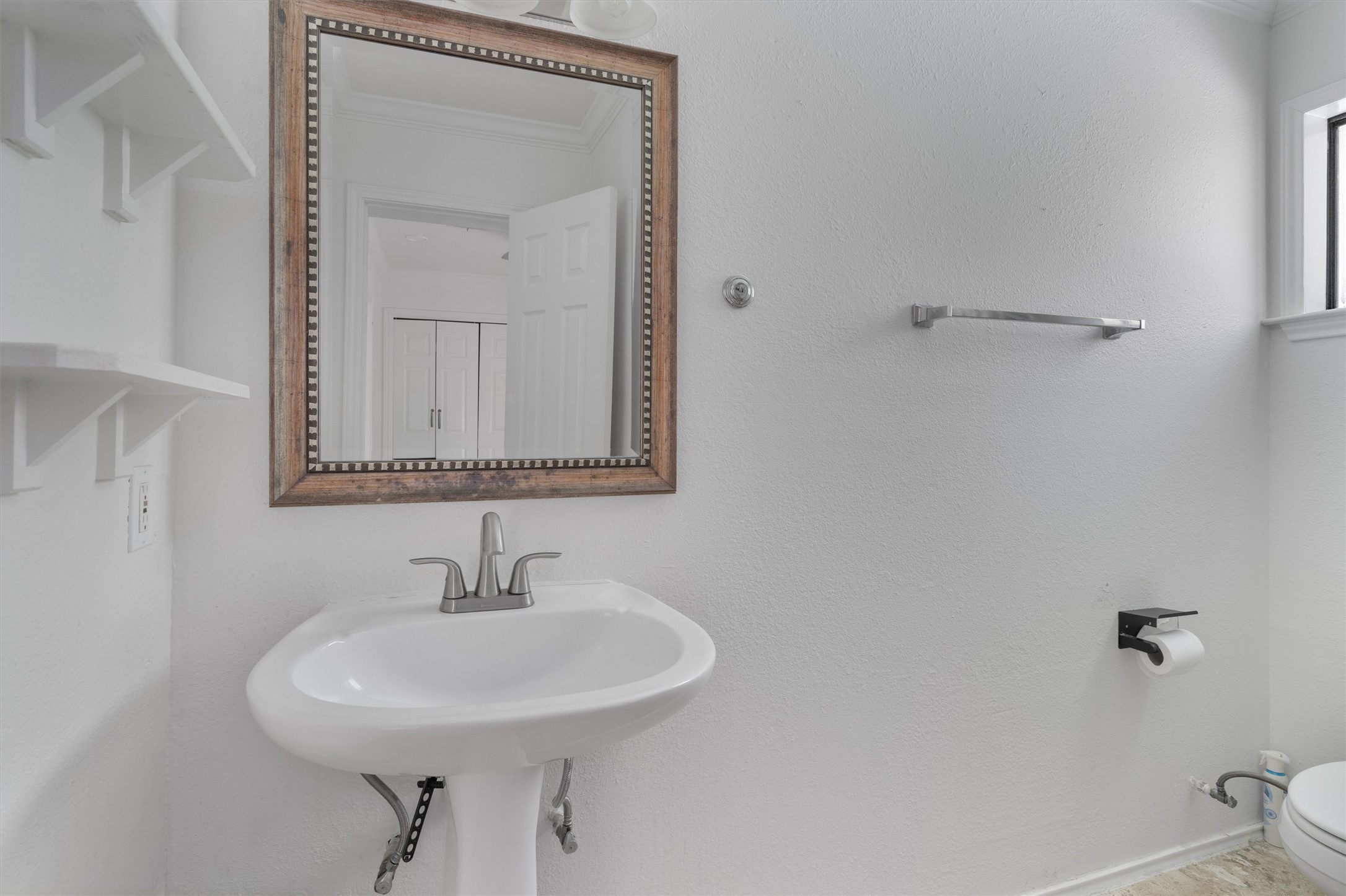 2710 East 3rd Street Austin, TX 78702 - Photo 23 of 28 a bathroom with a sink and a mirror