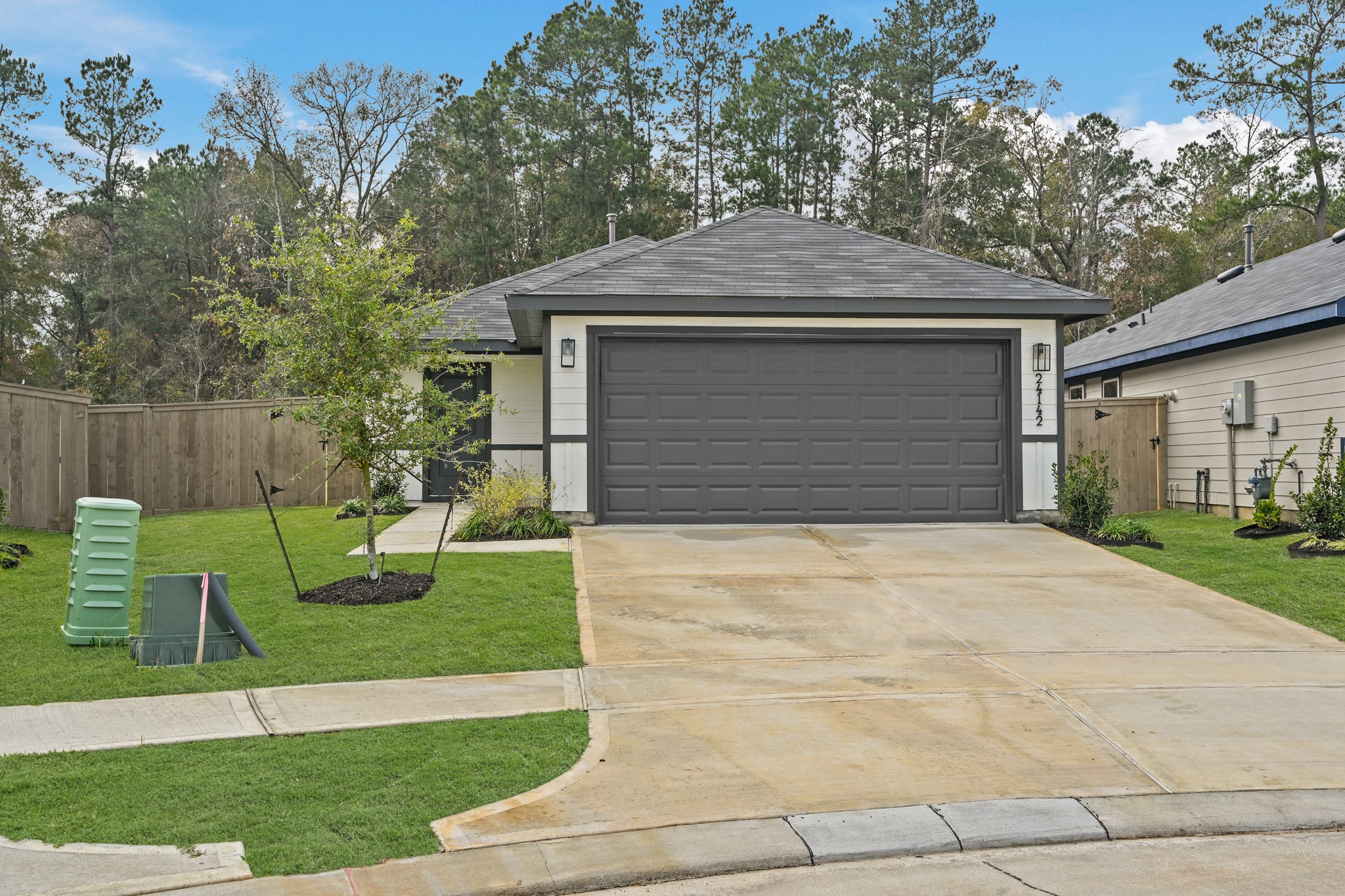 a front view of a house with garden