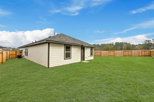 a view of a backyard with grass
