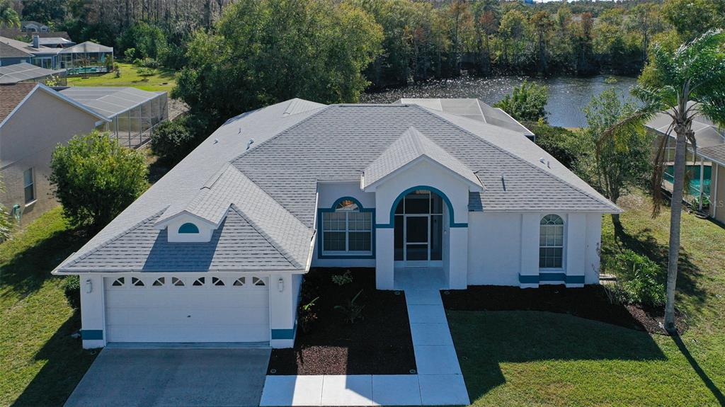 9016 Easthaven Court New Port Richey, FL 34655 - Photo 1 of 38 a aerial view of a house with garden