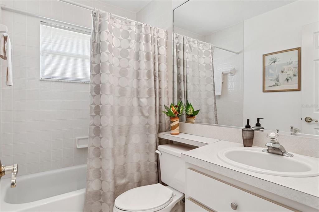 9016 Easthaven Court New Port Richey, FL 34655 - Photo 16 of 38 a bathroom with a sink a toilet and a bathtub
