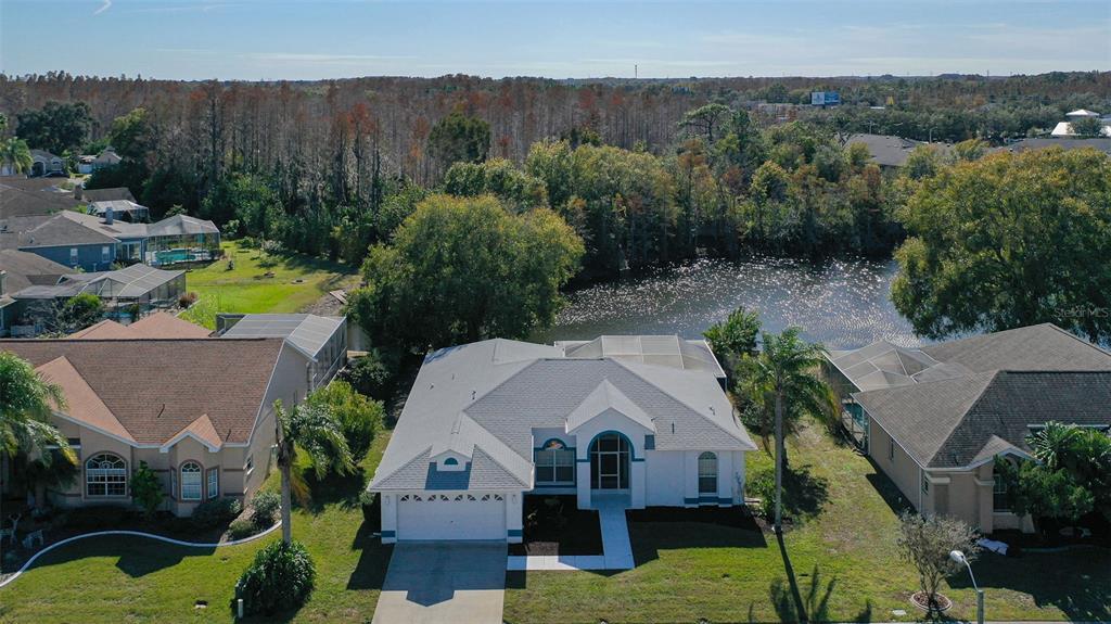 9016 Easthaven Court New Port Richey, FL 34655 - Photo 2 of 38 an aerial view of a house