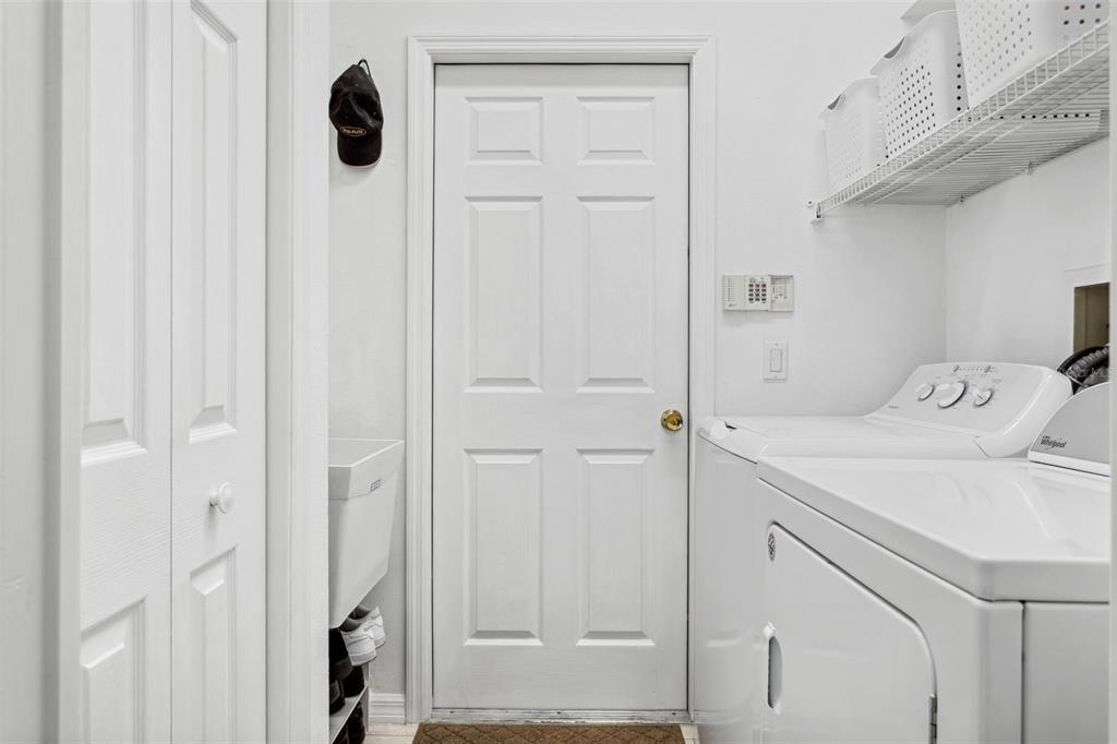 9016 Easthaven Court New Port Richey, FL 34655 - Photo 24 of 38 a room with a washing machine