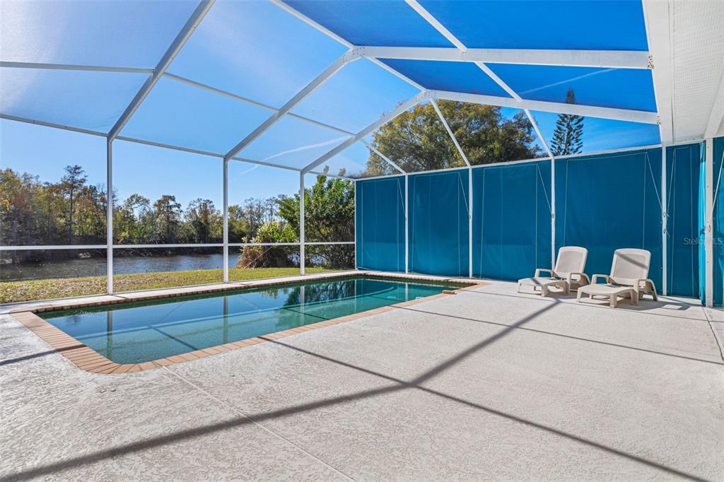 9016 Easthaven Court New Port Richey, FL 34655 - Photo 26 of 38 a view of a backyard with a sink and dishwasher