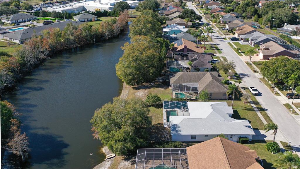 9016 Easthaven Court New Port Richey, FL 34655 - Photo 32 of 38 an aerial view of residential houses with outdoor space