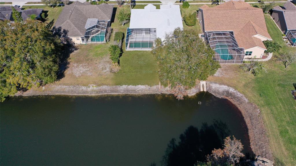 9016 Easthaven Court New Port Richey, FL 34655 - Photo 34 of 38 an aerial view of a house with a lake view
