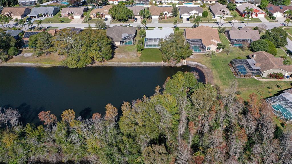 9016 Easthaven Court New Port Richey, FL 34655 - Photo 35 of 38 an aerial view of a house with a lake view